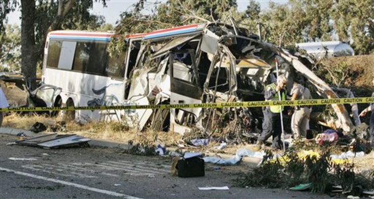 California Highway Patrol officers investigate a Greyhound bus crash on Highway 99 in Fresno, Calif., that killed six people.